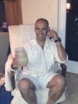 a happy birthday boy; margarita in one hand, his daughter on the phone in the other!